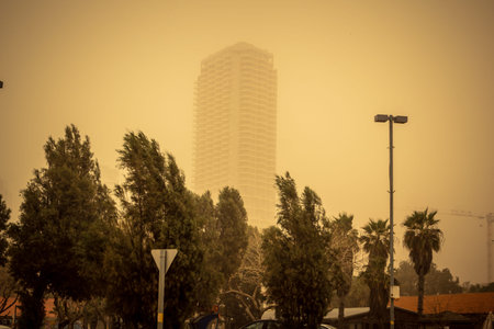 Tel Aviv, Israel, March 14, 2026 A thick layer of desert sand and dust blankets the streets during a...