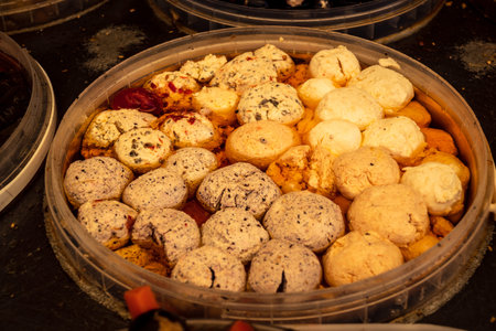 Hebron, West Bank, Palestine, March 28, 2026 A traditional Palestinian market stall in the historic old city of Hebron displays a sensory abundance of marinated olives and pickled vegetables. Dozens of open bowls and sacks overflow with aromatic products のeditorial素材