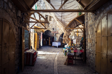 Hebron, West Bank, Palestine, March 28, 2026 The historic stone streets and ancient vaulted alleys of Hebron's old city appear largely deserted, with many Palestinian shops and businesses remaining closed. The high security presence and movement restrictiのeditorial素材