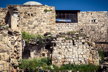 Hebron, West Bank, Palestine, March 28, 2026 The historic stone streets and ancient vaulted alleys of Hebron's old city appear largely deserted, with many Palestinian shops and businesses remaining closed. The high security presence and movement restrictiのeditorial素材