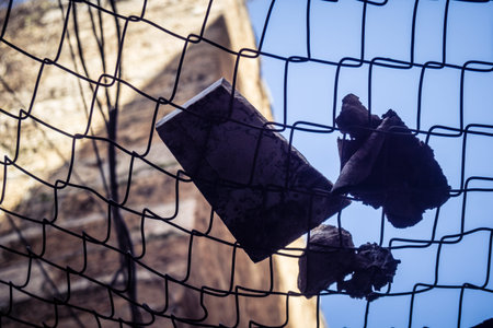 Hebron, West Bank, Palestine, March 28, 2026 Metal nets and fencing are stretched high above the narrow Palestinian commercial streets in the historic old city of Hebron. These installations serve as essential protection for local residents and shoppers aのeditorial素材