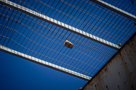 Hebron, West Bank, Palestine, March 28, 2026 Metal nets and fencing are stretched high above the...
