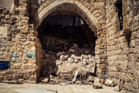 Hebron, West Bank, Palestine, March 28, 2026 The historic stone streets and ancient vaulted alleys of Hebron's old city appear largely deserted, with many Palestinian shops and businesses remaining closed. The high security presence and movement restrictiのeditorial素材