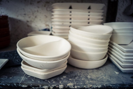 Hebron, West Bank, Palestine, March 28, 2026 A traditional Palestinian ceramics factory in the historic old city of Hebron continues its ancestral craft, established for over 400 years. These images capture the delicate pre-firing stage where raw clay bowのeditorial素材