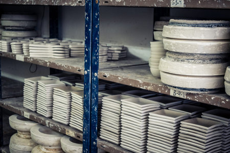 Hebron, West Bank, Palestine, March 28, 2026 A traditional Palestinian ceramics factory in the historic old city of Hebron continues its ancestral craft, established for over 400 years. These images capture the delicate pre-firing stage where raw clay bowのeditorial素材