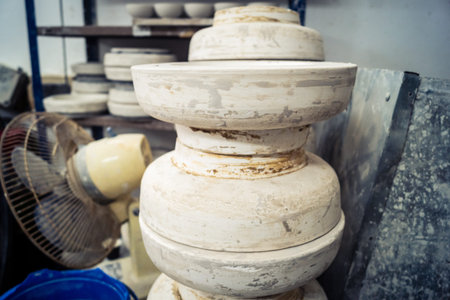Hebron, West Bank, Palestine, March 28, 2026 A traditional Palestinian ceramics factory in the historic old city of Hebron continues its ancestral craft, established for over 400 years. These images capture the delicate pre-firing stage where raw clay bowのeditorial素材