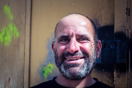 Hebron, West Bank, Palestine, March 28, 2026 Local Palestinian men are seen posing for portraits in the ancient stone streets and commercial alleys of Hebron's historic old city. These individuals, photographed at their own request, represent the adult poのeditorial素材