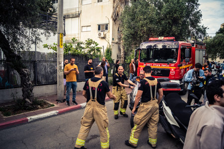 Tel Aviv, Ramat Gan, Israel, March 18, 2026 Emergency services including firefighters, paramedics,...
