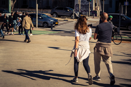 Tel Aviv, Israel, January 3, 2026 Passersby stroll along the Tel Aviv promenade facing the Mediterranean Sea, demonstrating daily resilience despite regional security tensions in the Middle East.のeditorial素材