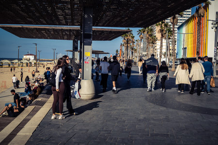 Tel Aviv, Israel, January 3, 2026 Passersby stroll along the Tel Aviv promenade facing the Mediterranean Sea, demonstrating daily resilience despite regional security tensions in the Middle East.のeditorial素材