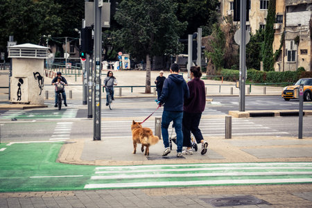 Tel Aviv, Israel, March 7, 2026 People walking through the busy urban streets of Tel Aviv, capturing the essence of city life.のeditorial素材