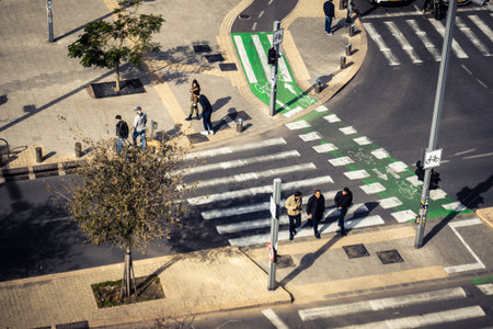 Tel Aviv, Israel, January 21, 2026 Passersby stroll through the Florentine district, renowned for its unique architectural heritage, ranging from historic Bauhaus buildings to modern dwellings.のeditorial素材