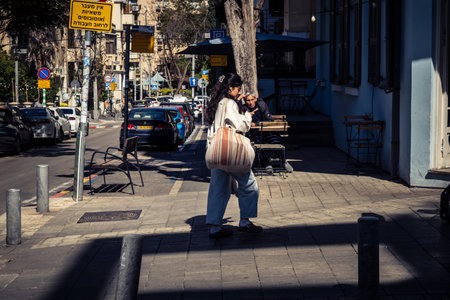 Tel Aviv, Israel, February 26 2026, Pedestrians walking on Sheinkin Street, lively urban scene with...