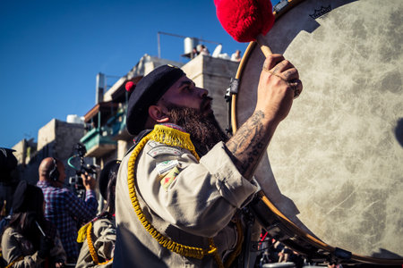 Bethlehem, West Bank, December 24, 2025 Close-up details of a Palestinian scout marching band during the Christmas parade. Intensity of the musicians defines this traditional holiday celebration.のeditorial素材