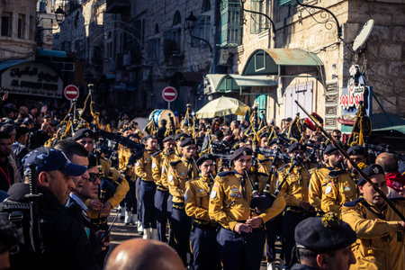 Bethlehem, West Bank, December 24, 2025 Palestinian scout marching band performs during the Christmas parade. Musicians dressed in traditional uniforms lead the procession through the historic streetsのeditorial素材