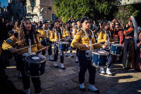 Bethlehem, West Bank, December 24, 2025 Palestinian scout marching band performs during the Christmas parade. Musicians dressed in traditional uniforms lead the procession through the historic streetsのeditorial素材