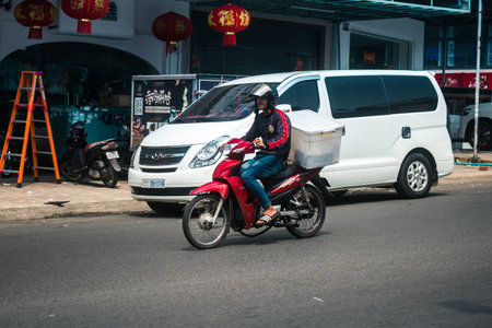 Sihanoukville, Cambodia, February 3, 2025 Traffic in the streets of Sihanoukville, a coastal city in Cambodia. Renowned for its rich cultural heritage, bustling market and vibrant street life.のeditorial素材