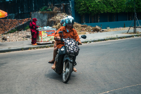 Sihanoukville, Cambodia, February 3, 2025 Traffic in the streets of Sihanoukville, a coastal city in Cambodia. Renowned for its rich cultural heritage, bustling market and vibrant street life.のeditorial素材
