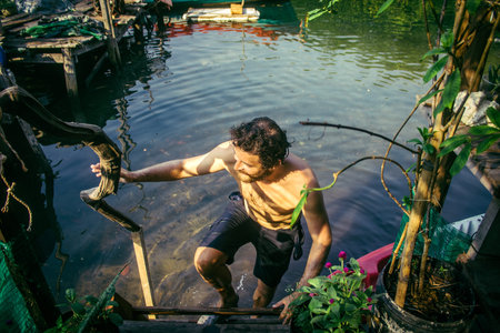 Preak Svay, Koh Rong Island, Cambodia, February 6, 2025 Tourists visiting an authentic floating Khmer fishing village located in the north of the island. The main activity of the population is fishingのeditorial素材
