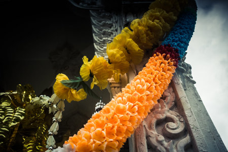 Koh Chang, Thailand, February 21, 2025 Mini Buddhist temple on the streets of Koh Chang. The temple and figurines were installed by locals in front of the entrance of every house or business.のeditorial素材