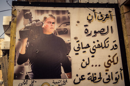 Hebron, West Bank, January 30, 2026 Arabic language posters, political signs and torn advertisements on urban walls in the city center of Hebron.のeditorial素材
