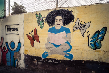 Hebron, West Bank, January 30, 2026 Arabic language posters, political signs and torn advertisements on urban walls in the city center of Hebron.のeditorial素材