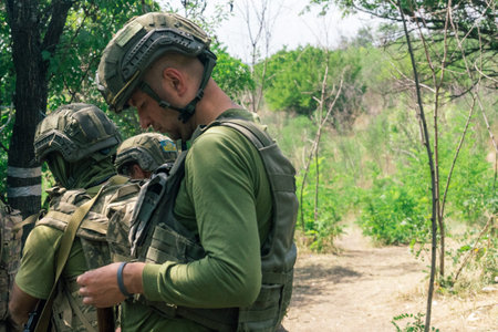Donbass, Ukraine, August 16, 2025 Ukrainian soldiers train in various combat techniques. They...