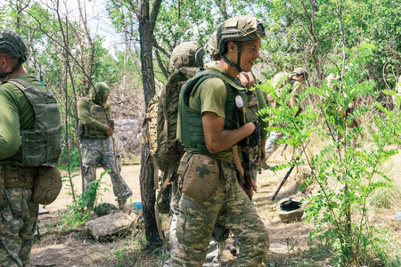 Donbass, Ukraine, August 16, 2025 Ukrainian soldiers train in various combat techniques. They...