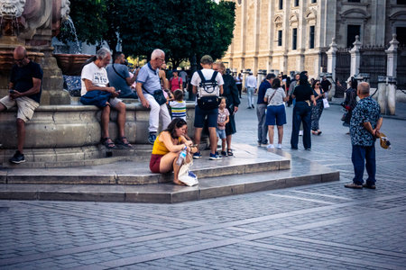 Seville, Spain, September 21, 2025 Tourists visit the historic district of downtown Seville and walk through the narrow, picturesque streets.のeditorial素材
