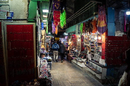 Jerusalem, Israel, December 13, 2025 Busy alleyways and atmospheric plays of light in the Christian...