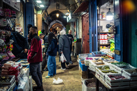 Jerusalem, Israel, December 13, 2025 Busy alleyways and atmospheric plays of light in the Christian...