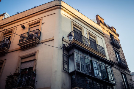 Seville, Spain, September 21, 2025 Architecture and facade of the buildings in the historic district in downtown Seville.のeditorial素材