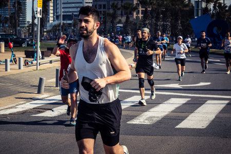 Tel Aviv, Israel, February 27, 2026 Large crowd of runners competing in the streets during the...