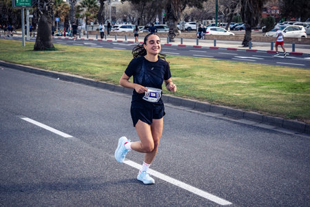 Tel Aviv, Israel, February 27, 2026 Runners competing in the streets during the annual marathon, thousands of participants joining the major sporting event in Tel Aviv.のeditorial素材