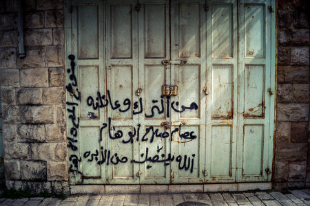 Hebron, West Bank, Palestine, March 28, 2026 Palestinian political graffiti, including Free...