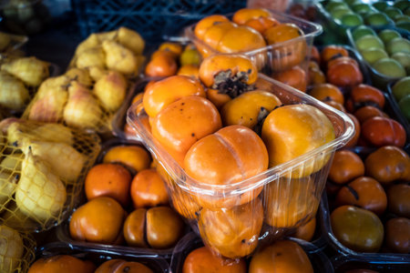 Hebron, West Bank, Palestine - February 12, 2026 Fresh fruits display for sale on a stall at the traditional market in the old city of Hebron. Daily life and local trade in the Palestinian territory.のeditorial素材