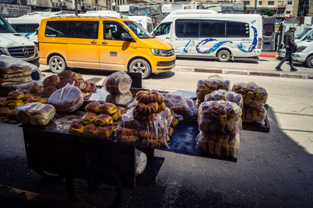 Hebron, West Bank, Palestine, March 31, 2026 Local street vendors are seen displaying a variety of...
