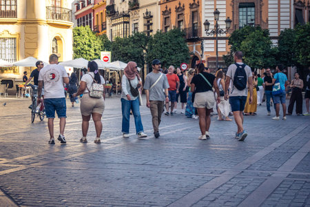 Seville, Spain, September 21, 2025 Tourists visit the historic district of downtown Seville and walk through the narrow, picturesque streets.のeditorial素材
