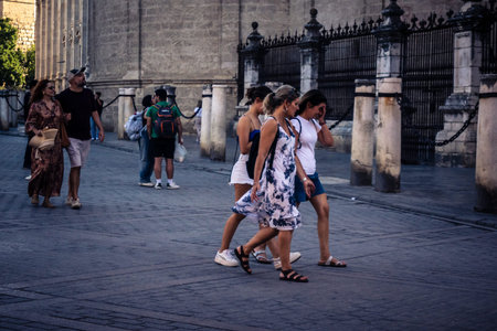 Seville, Spain, September 21, 2025 Tourists visit the historic district of downtown Seville and walk through the narrow, picturesque streets.のeditorial素材