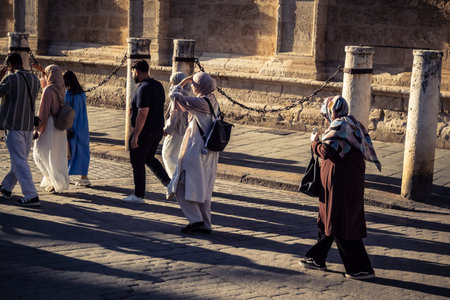 Seville, Spain, September 21, 2025 Tourists visit the historic district of downtown Seville and walk...