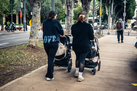 Tel Aviv, Israel, January 14, 2026 People at Rothschild Boulevard in Tel Aviv, a vibrant, tree-lined...