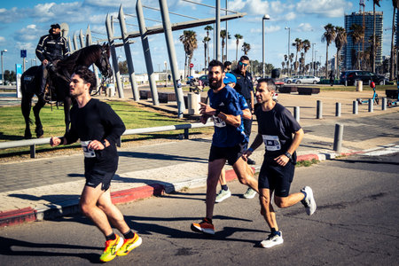 Tel Aviv, Israel, February 27, 2026 Runners competing in the streets during the annual marathon, thousands of participants joining the major sporting event in Tel Aviv.のeditorial素材