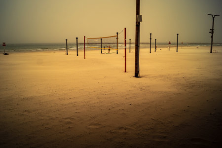 Tel Aviv, Israel, March 14, 2026 Empty playgrounds and beach structures stand abandoned as a thick shroud of desert dust engulfs the Mediterranean coastline, creating a surreal monochromatic landscape and extreme atmospheric conditions during a Sharav eveのeditorial素材