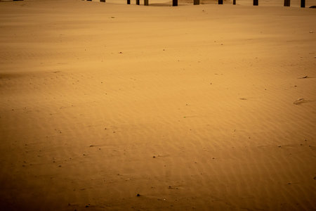 Tel Aviv, Israel, March 14, 2026 Empty playgrounds and beach structures stand abandoned as a thick shroud of desert dust engulfs the Mediterranean coastline, creating a surreal monochromatic landscape and extreme atmospheric conditions during a Sharav eveのeditorial素材