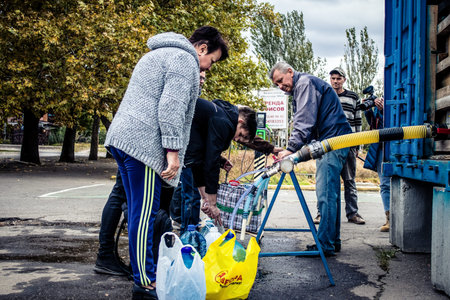 Mykolaiv, Ukraine, October 22, 2022 People come to get water between two bombardments. Following the...