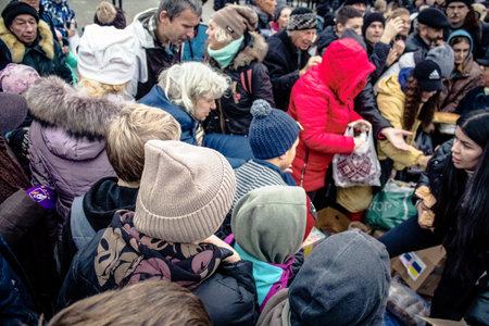 Kherson, Ukraine, November 20, 2022 Residents  receive food supplies in Freedom Square. The tension...