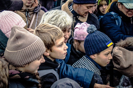 Kherson, Ukraine, November 20, 2022 Residents  receive food supplies in Freedom Square. The tension is very strong and people are very exasperated. International humanitarian aid is organized when people lack everything.のeditorial素材