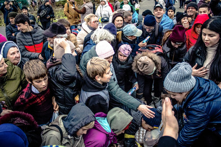 Kherson, Ukraine, November 20, 2022 Residents  receive food supplies in Freedom Square. The tension...