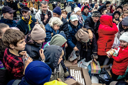 Kherson, Ukraine, November 20, 2022 Residents  receive food supplies in Freedom Square. The tension...