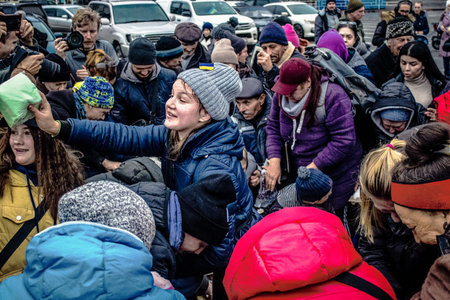 Kherson, Ukraine, November 20, 2022 Residents  receive food supplies in Freedom Square. The tension...